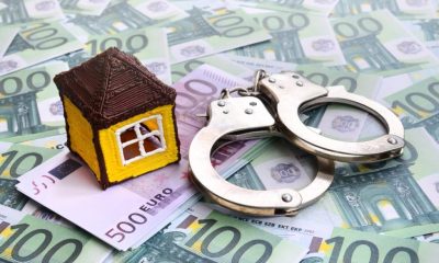 small-toy-house-handcuffs-is-lies-set-green-monetary-denominations-100-euros-1024x678-1